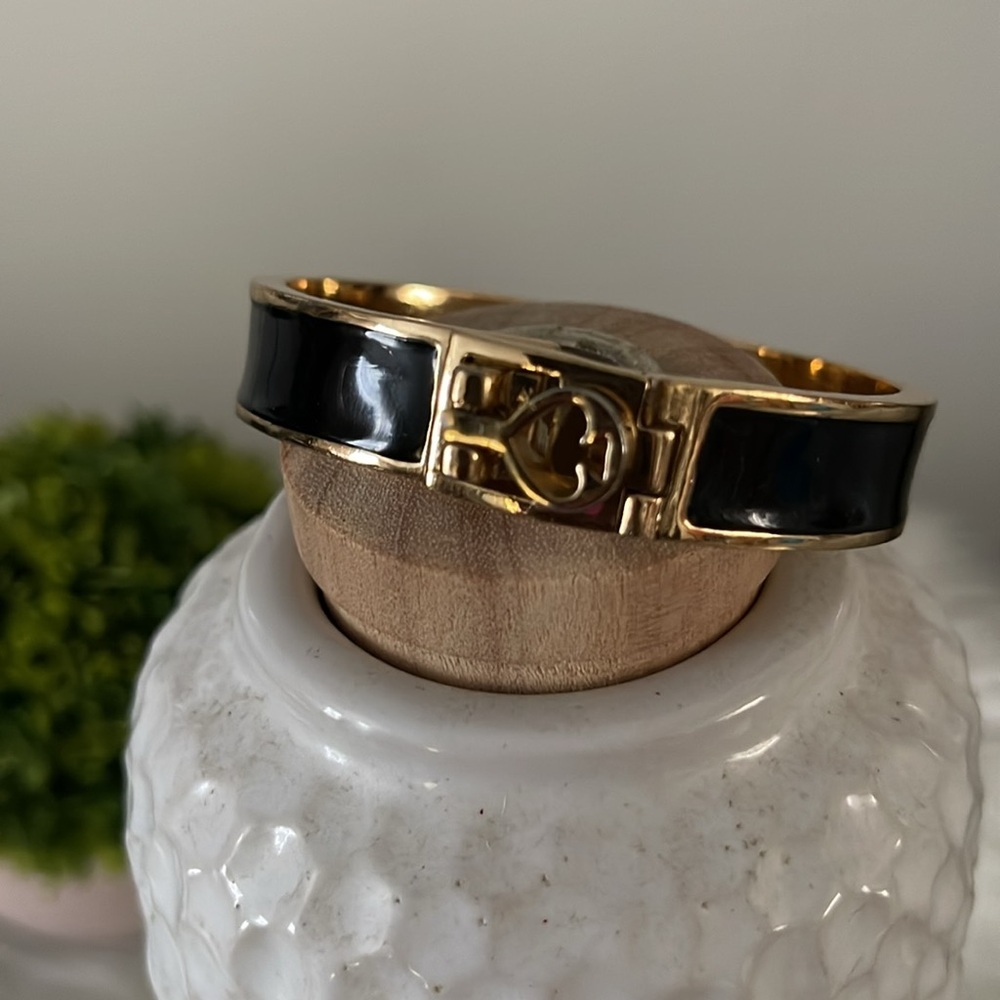 Kate Spade gold and black bangle bracelet with opening. EUC.